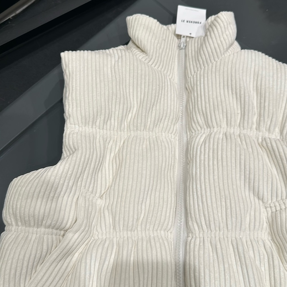 Cream colored vest